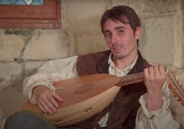 a man in a vest playing a musical instrument