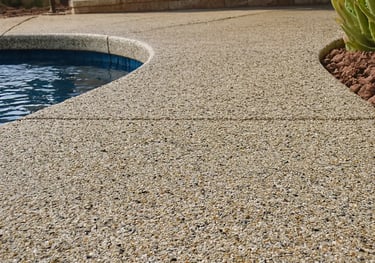 a pool with exposed aggregate concrete deck