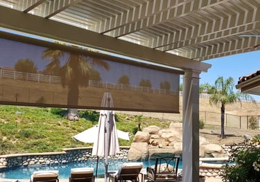 Drop shade installed on patiocover with veiw of pool.