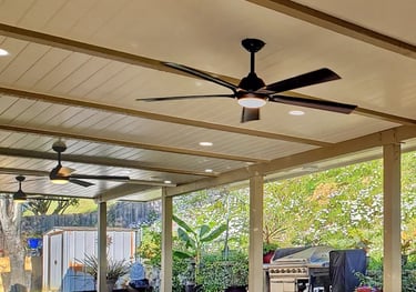 Custom wood patio cover creating a beautiful outdoor living space with lights and fans. Located in Escondido, California, 