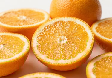 Vibrant, macro photography of fresh B-vitamin rich citrus fruits sliced open, showing the juicy interior against an Off-White background. Bright, invigorating style.