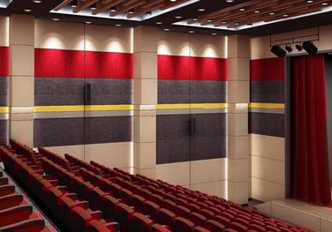 a theater room with rows of red seats and red curtains