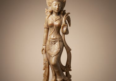 Hand-carved onyx stone sculpture of a graceful goddess figure with intricate details and a soft gold