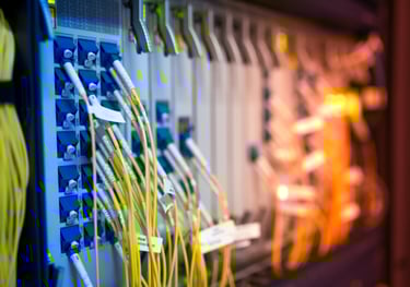 a bunch of cables and wires connected to a wall