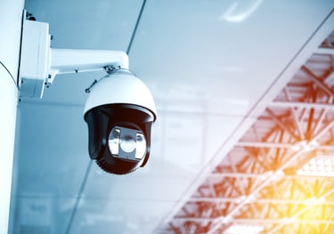 a camera mounted on a wall in a building