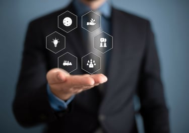 a man in a suit and tie is holding a hand out to show off his