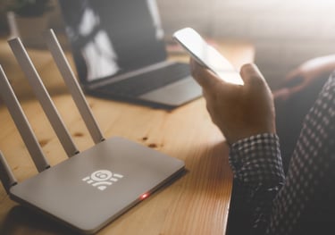 a person holding a cell phone and a cell phone