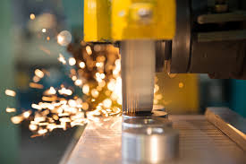 a machine is cutting through a piece of metal