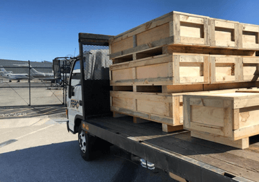 a truck with a load of pallets on it