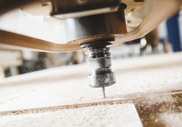 a cnc drilling a piece of wood