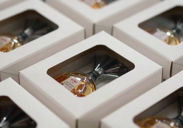 Close-up of high-quality die-cut cartons featuring intricate custom windows, showcasing the precision of the manufacturing process and clear product visibility.