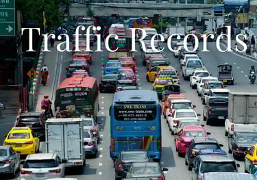 a bus is driving down a busy street - KamBri Solutions