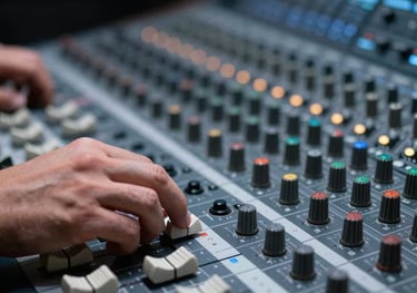 A close-up shot of a producer's hand adjusting a high-tech mixing console in a professional recording studio, with sharp focus and cool slate blue lighting.