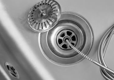 clearing a clogged drain with a snake in Surprise