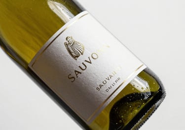 A bottle of Sauvignon Blanc wine with a custom metallic label, professional studio photography on white background.