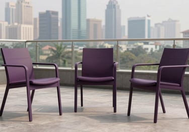 Contemporary outdoor chairs in a deep purple finish, positioned on a professional building terrace with a view of a South Asian city skyline.
