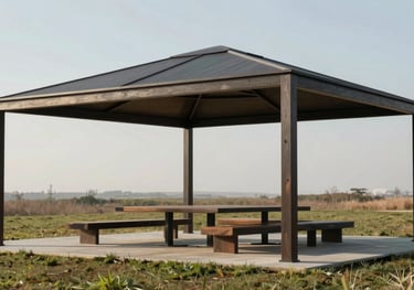 Architectural gazeebo structure with a minimalist dark frame made from sustainable materials, providing shaded seating in a professional landscape.