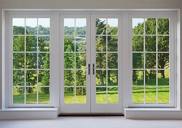 a room with a large window and a view of a field
