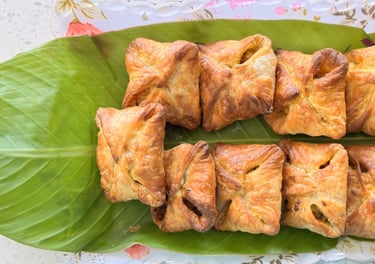 Veg puff filled with spiced vegetables, served fresh at Aroha Dosas