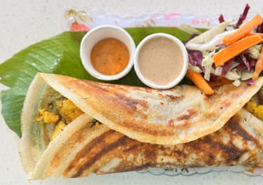 Masala dosa filled with spiced potato, served fresh at Aroha Dosas