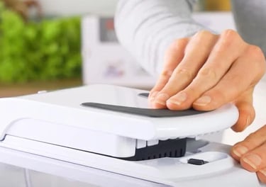 a person is holding a chopper lid