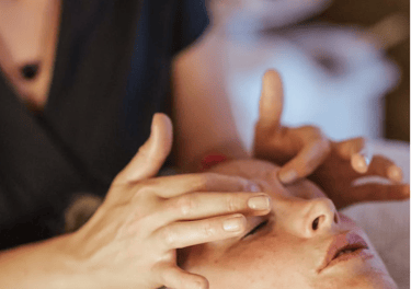 A person getting their forehead massaged.