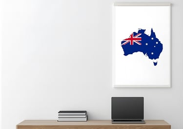 Desk with a laptop and map of Australia for learning English for relocation