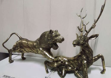 "Handcrafted brass sculpture of a lion hunting a deer-Qualified for export"