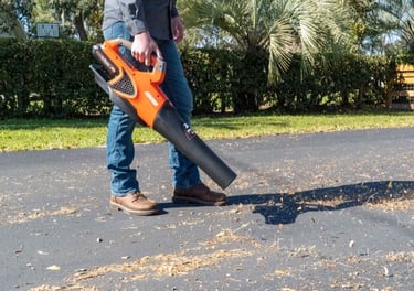Clearing driveway of any debris in preparation for sealcoat