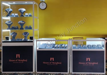 a display case with a clock and jewelryExhibition by Bhima Jewellers Kerla using our Portable Showca