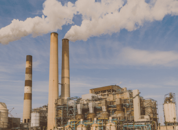 a factory with smoke stacks and smoke stacks