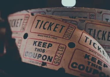 A roll of vintage raffle tickets with keep this coupon text for a retro movie theater or event.