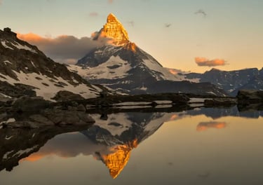 Sunset glowing on the Matterhorn peak reflected in Stellisee lake in the Swiss Alps.