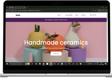 a laptop computer screen displaying a website page with a handmade ceramic vase