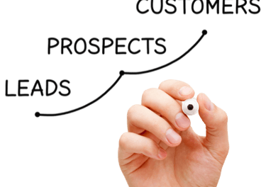 a person holding a pen and writing on a white board