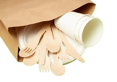 a paper bag with wooden spoons