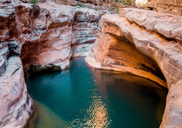 a river flowing through a canyon in the middle of a canyon
