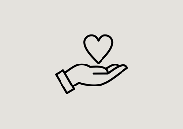 a hand holding a heart shaped object