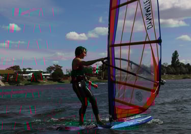 a woman windsurfing on a sunny day