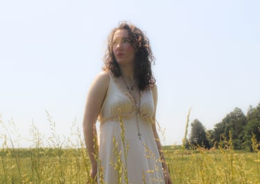 Aesthetic cinematic portrait of girl at golden hour in a meadow in Midland, virginia