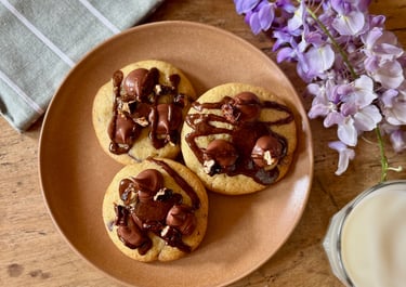 a plate with cookies and milk on a plate