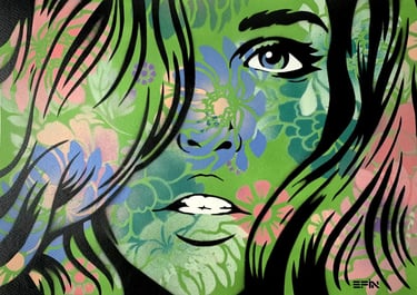 Artwork of a womans face in green spray paint