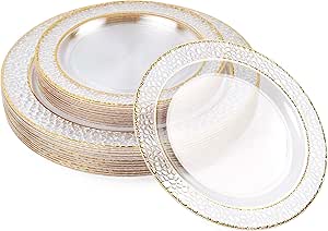 a stack of plates with gold rims and a white background