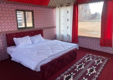 a bed with a red carpet and a red carpet
