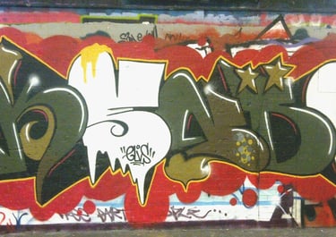 European graffiti writing on wall — urban lettering Kende street art background