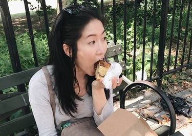 little twist bakery founder eating on a bench in NYC