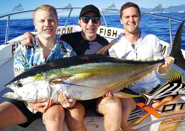 three men sitting on a boat with a big fish