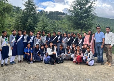 Group or schoolgirls outside with Ambassador Pooja C.