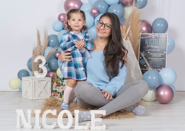 a woman and her son posing for a photo