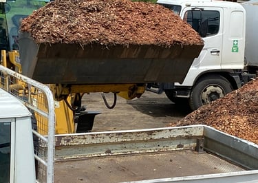 loader with bucket of mulch